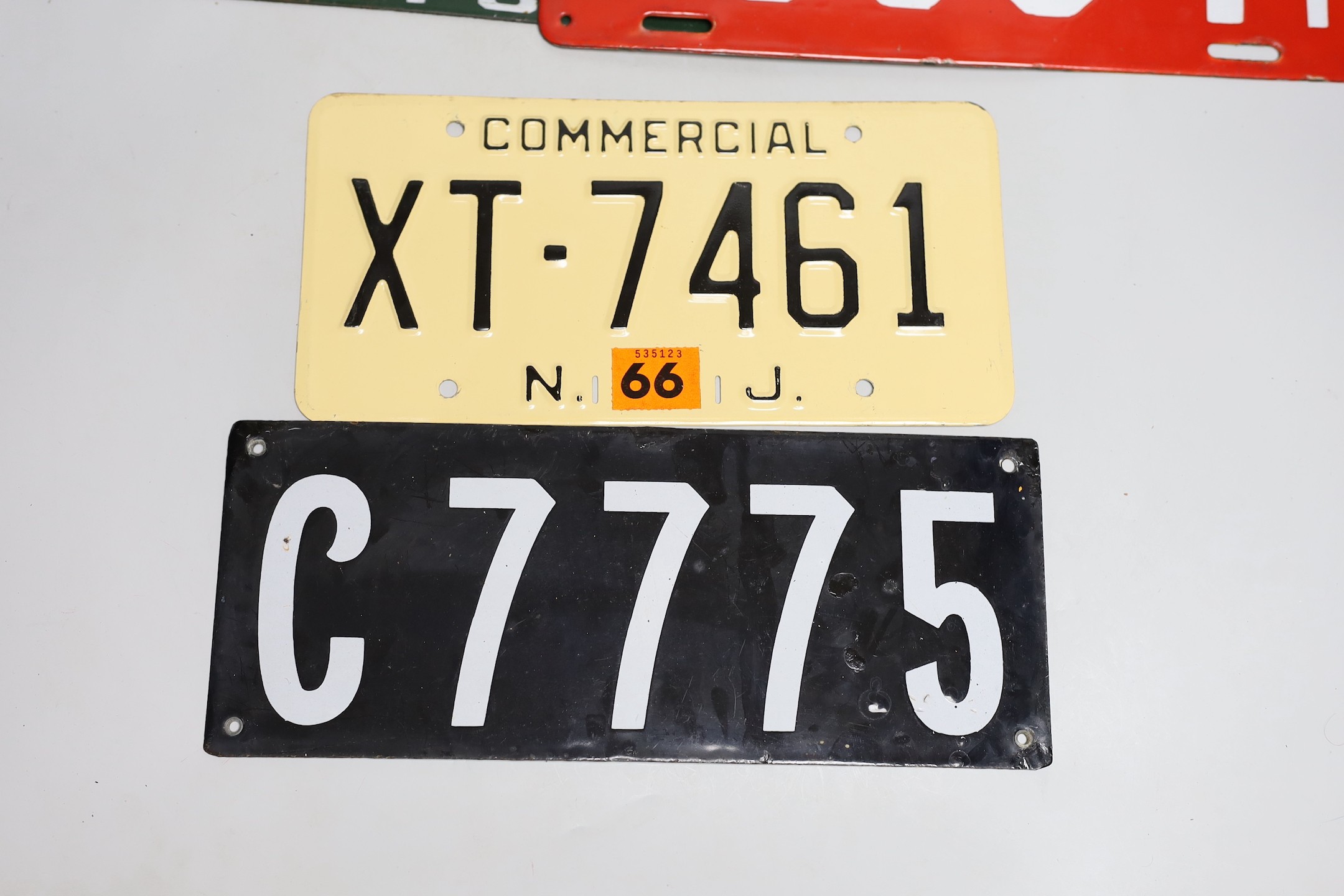 A mixed group of nine USA enamel car registration number plates